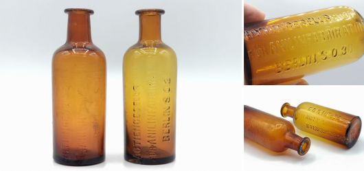 Two brown aniline glass bottles labeled