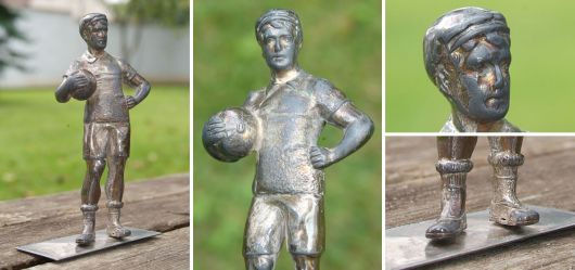 Silver plated footballer-statue