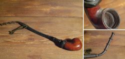Old tobacco pipe made of wood